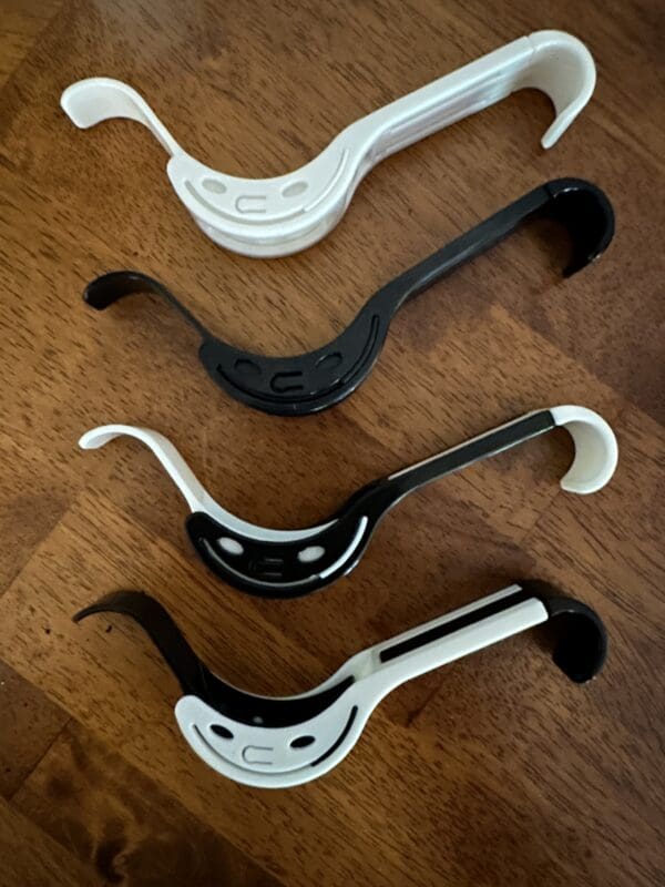 A group of four handles that are sitting on the floor.