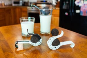 A table with milk and cookies on it