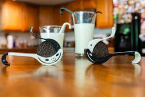 A table with two spoons and cups on it