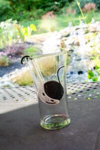 A glass with a black and white design on it