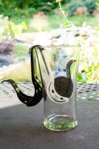 A glass with a horse head on it